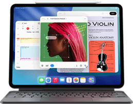 iPad Air zobrazující plochu s různými aplikacemi Apple, spárovaný s Magic Keyboardem a Apple Pencilem Pro