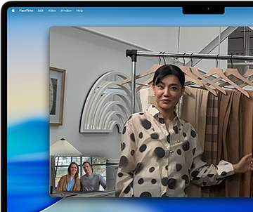 A video call on a MacBook Pro, during which a woman shows two other people various fabrics; centering the shot keeps her in the middle of the frame as she moves around.